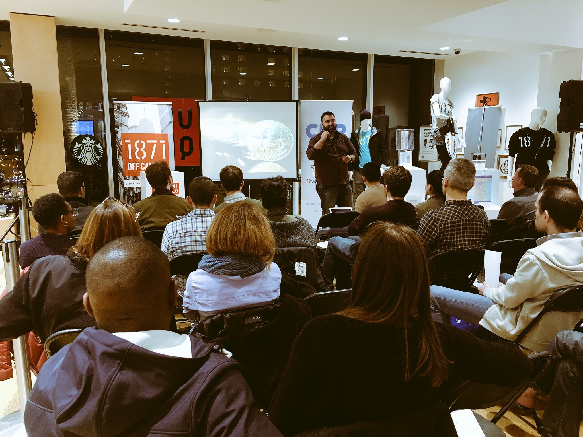 Joe Hernandez speaking at a tech event at 1871